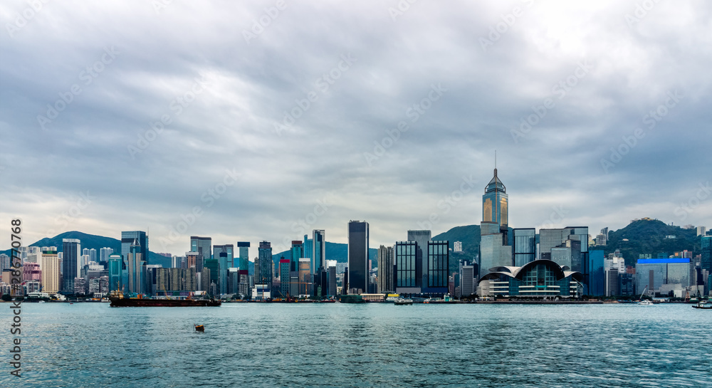 Stormy clouds over Hong Kong bay, city scyline