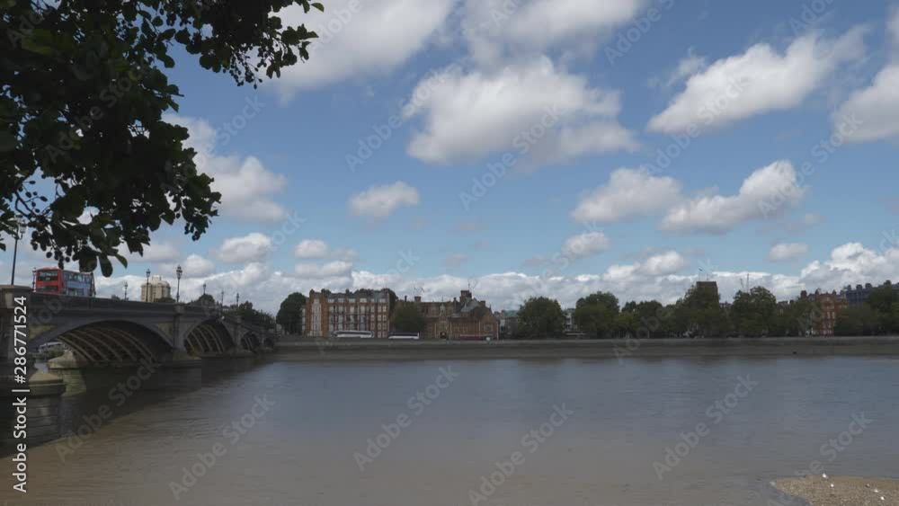 A bridge on Thames River and buildings on the riverside. A bridge on Thames River and buildings on the riverside.