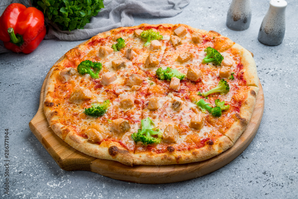 Pizza with salmon and broccoli on beautiful grey table