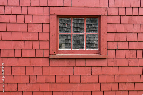 Small Window on the Side of Red Building