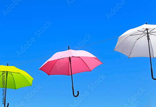 Colorful umbrellas against the blue sky