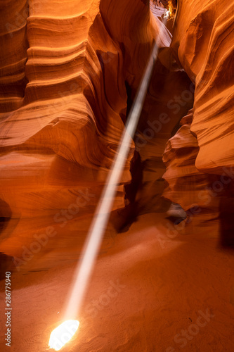 Light beams in Upper Antelope Canyon during midday photography tour