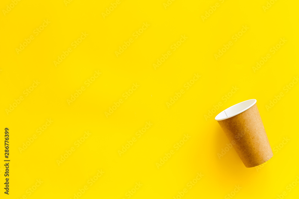 paper cups for coffee to take away on yellow background space for text paper cups for coffee to take away on yellow background space for text