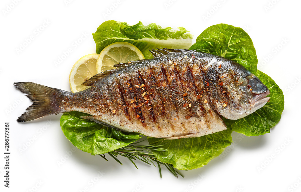 grilled fish on green salad leaves - obrazy, fototapety, plakaty 