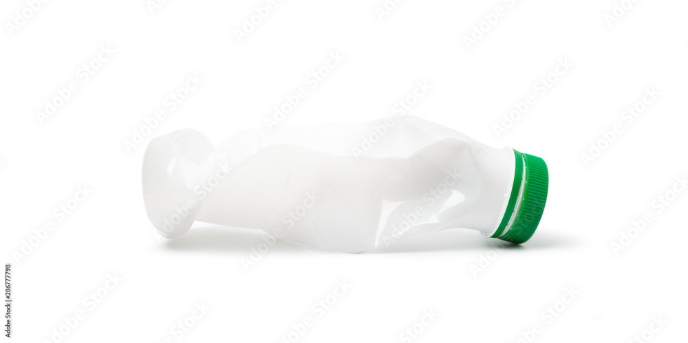 Foto Simple deformed plastic bottle isolated on a white