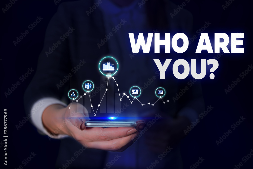 Handwriting text Who Are You question. Conceptual photo asking demonstrating identity or demonstratingal information Woman wear formal work suit presenting presentation using smart device