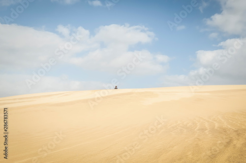 Quadbiking on sand dune, Stockton Sand Dunes, NSW, Australia