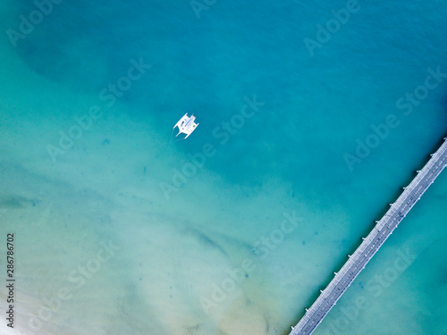 Catamaran moored at Fraser Island jetty Queensland australia © Orion Media Group