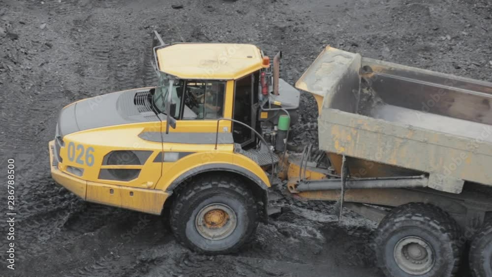Empty mining dump truck unfolds for coal loading. Empty mining dump truck unfolds for coal loading.