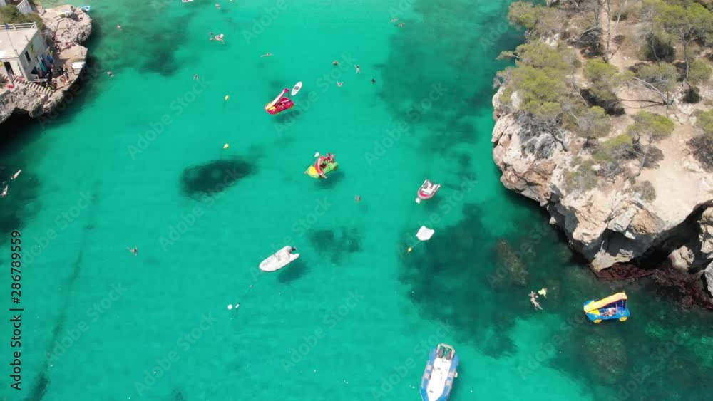 Spain Mallorca Cala Llombards and Cala Santanyi at 4k 24fps with ND filters flying with a DJI Mavic Air with beautiful views of the beaches, rocks, boats and blue water Spain Mallorca Cala Llombards and Cala Santanyi at 4k 24fps with ND filters flying with a DJI Mavic Air with beautiful views of the beaches, rocks, boats and blue water