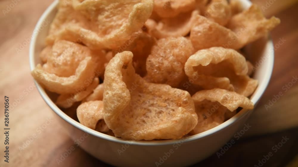 White Bowl of Fried chicharrones (pork rind) White Bowl of Fried chicharrones (pork rind)