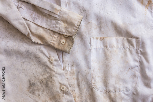 Very rusty messy white color old shirt close up for background use.