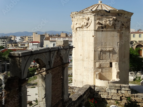 Tower of the Winds in Roman Agora complex in Athens city in Greece. The Roman Agora was encroached and obstructed by Roman buildings, and is known to have been a peristyle open space.  photo