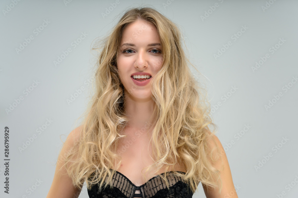 A large photo portrait of a pretty model with long flowing hair and a beautiful hairstyle on a white background. A large photo portrait of a pretty model with long flowing hair and a beautiful hairstyle on a white background.