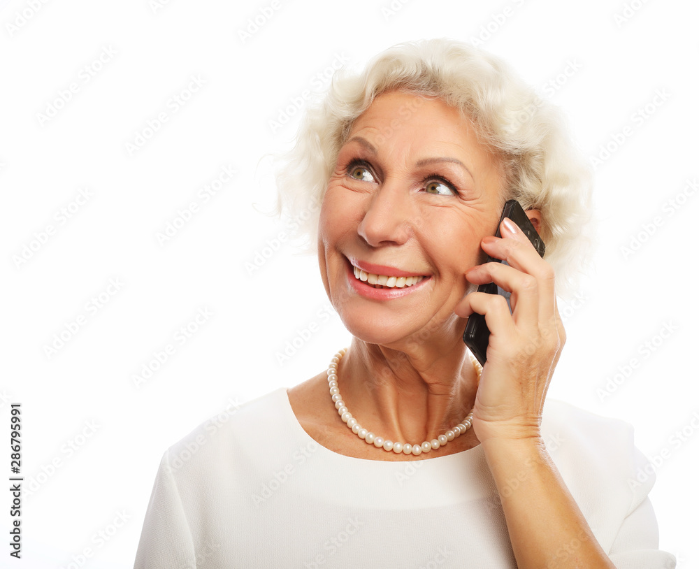 technology, communication age and people concept: happy senior woman with smartphoneover white background technology, communication age and people concept: happy senior woman with smartphoneover white background