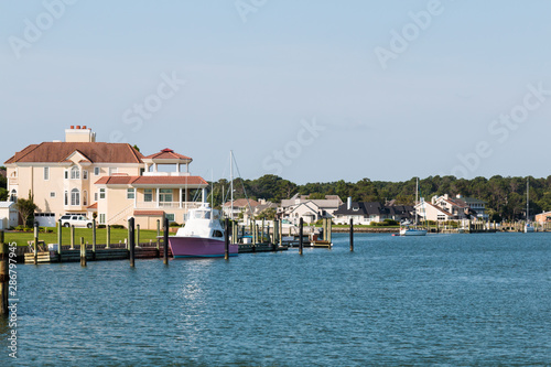 Homes and boats on Lake Wesley at Rudee Inlet in Virginia Beach, Virginia.  photo