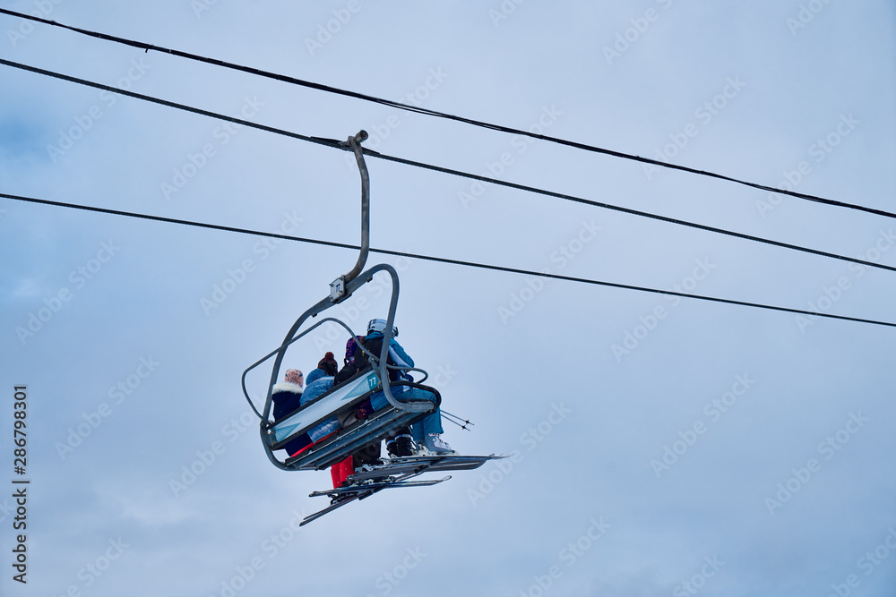 Image of a chair lift at a ski resort.