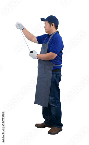asian worker man in blue shirt with apron and protective gloves hand holding Measuring Tape isolated on white