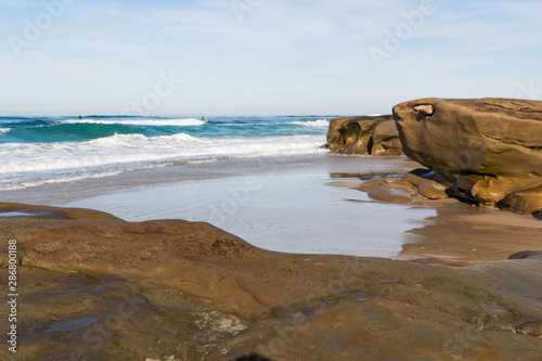 Sandstone rock formations at Windansea Beach, a popular surfing spot in La Jolla, California.