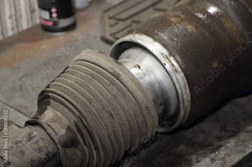 Close up broken car air spring, pneumatic suspension repair - pressure test