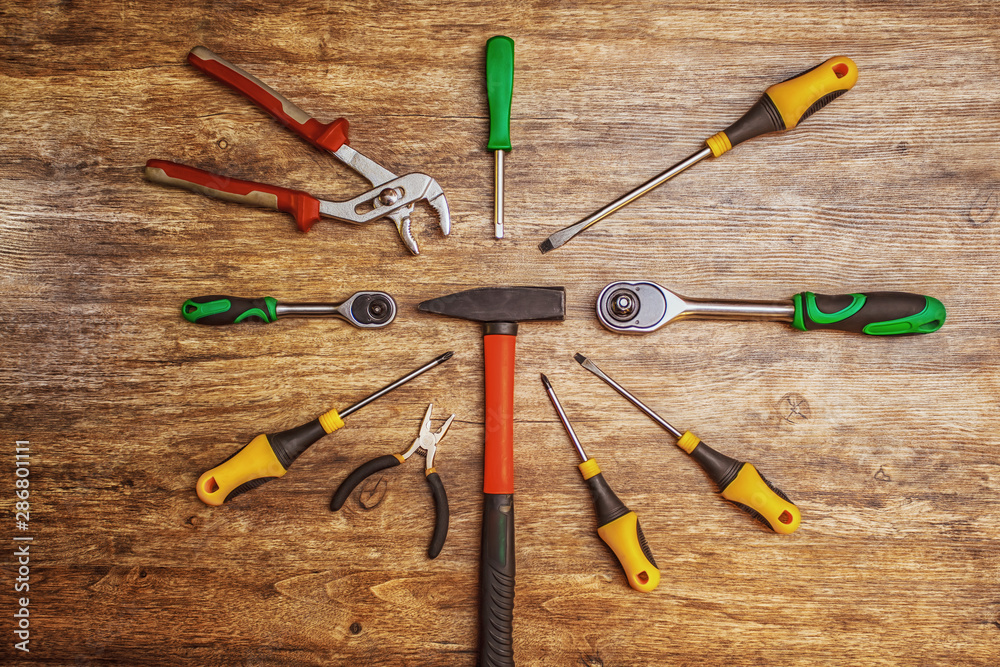 Set of different working tools on wooden background. Top view. Hand tool.  Tools male workplace background texture dark wood. Copy space. Space for  text. Photos | Adobe Stock