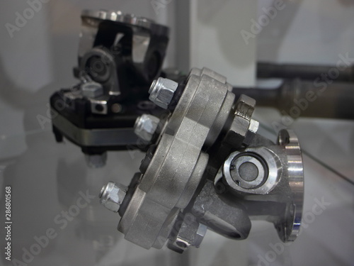 Cross joint with elastic coupling of the cardan shaft of the car close up, vehicle transmission parts