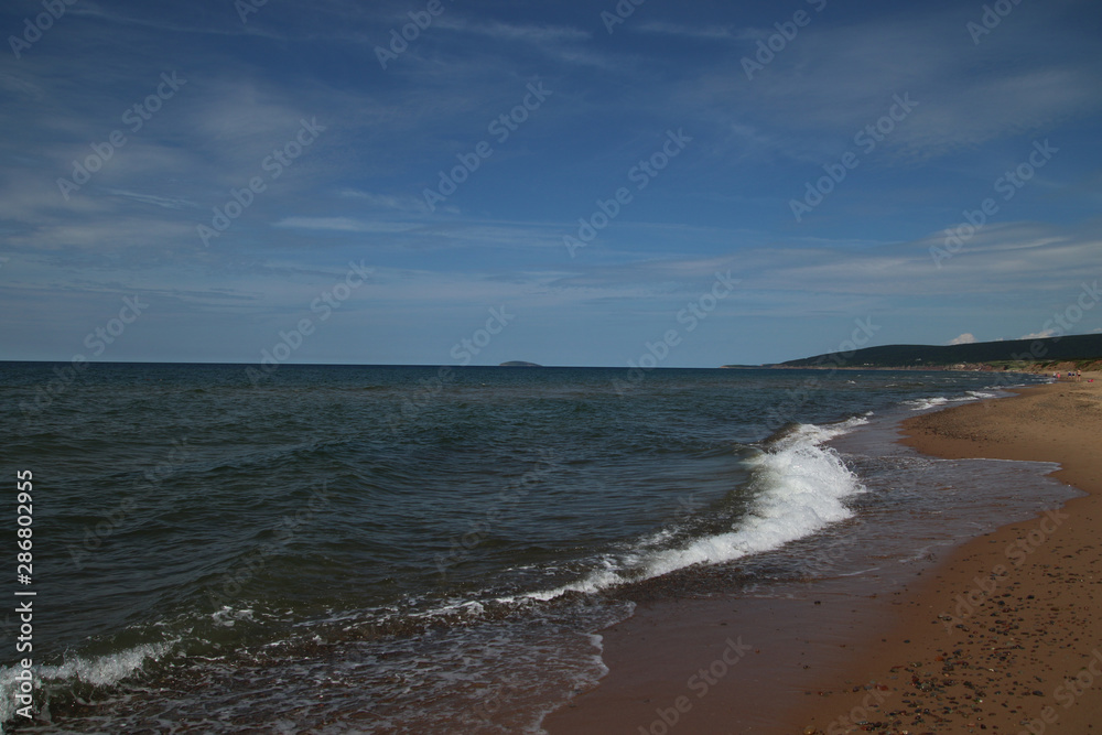 A view of the horizon with a sandy beach
