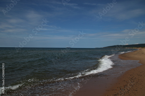A view of the horizon with a sandy beach