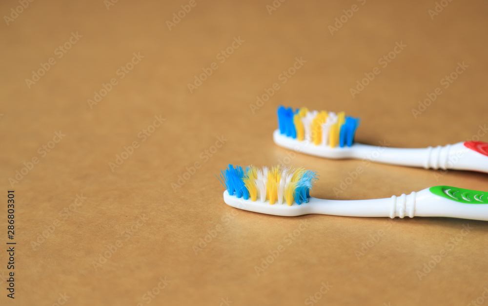old toothbrush on brown paper old toothbrush on brown paper