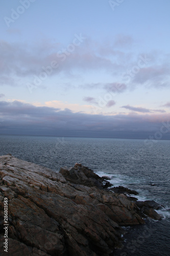 The waves coming into a barren section of land © David