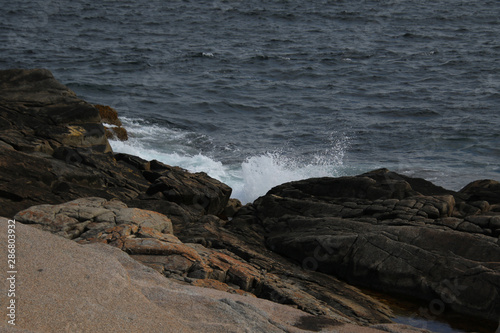 Waves crashing against rocks © David