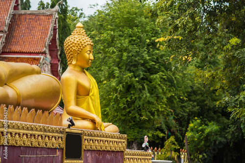 Buddha statue at Wat Chaiyo Warawithan temple, most popular religion traveling destination at Angthong province, Thailand. photo