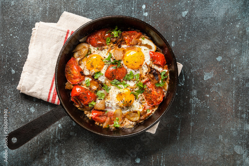 Fried eggs with tomatoes and bacon