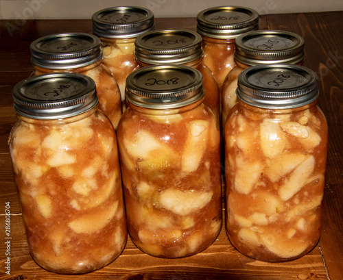 Eight jars of canned apple pie filling