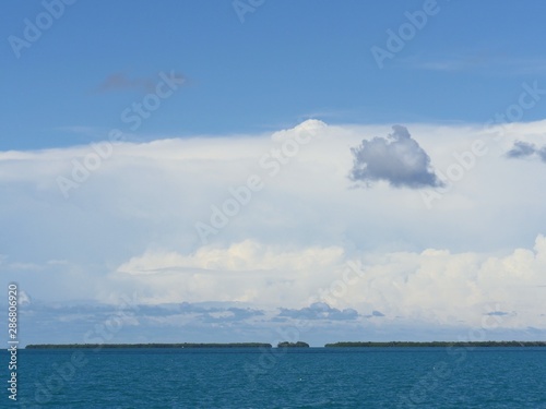 Wide shot of some of the Florida Keys, with gorgeous clouds in the skies