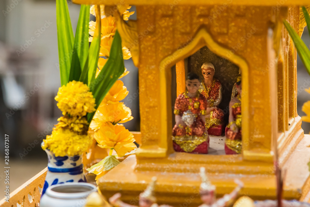 Miniature guardian spirit house. Small buddhist temple shrine, colorful