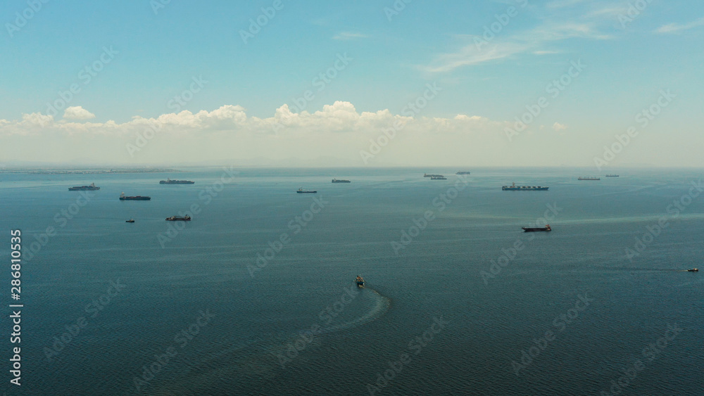 Cargo vessels in Manila Bay view from above. Cargo ships in the harbor.