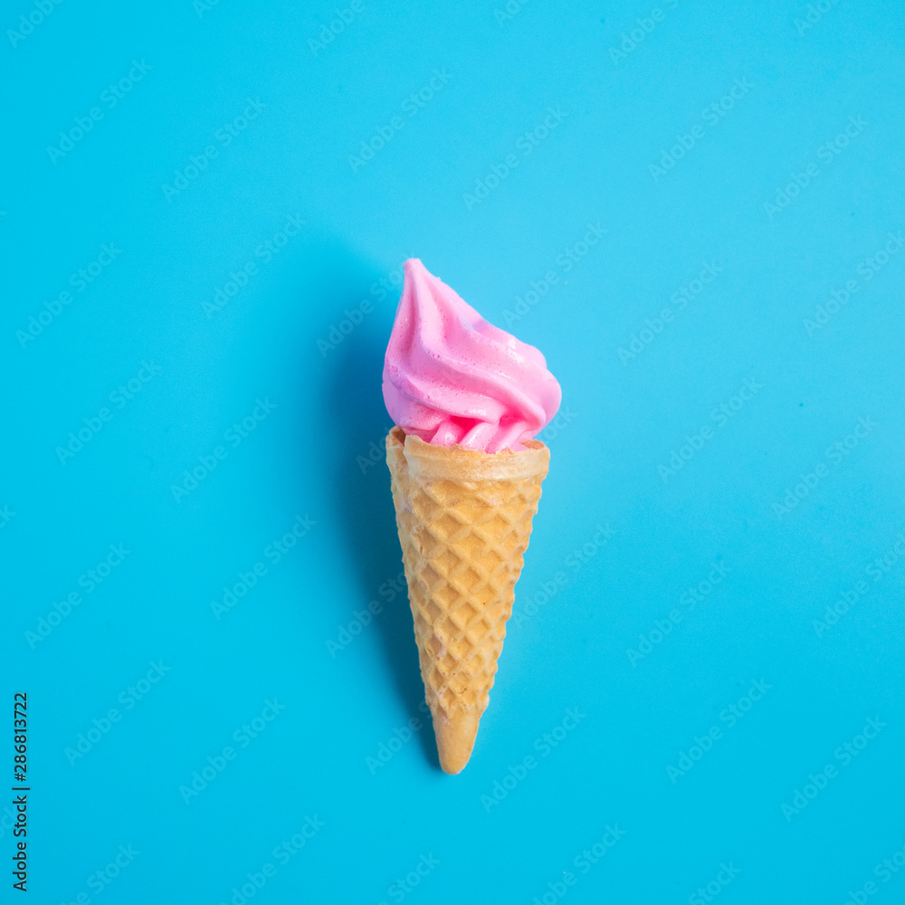 Colorful sweet ice cream cone isolated on blue pastel background ,holiday and relax concept Colorful sweet ice cream cone isolated on blue pastel background ,holiday and relax concept