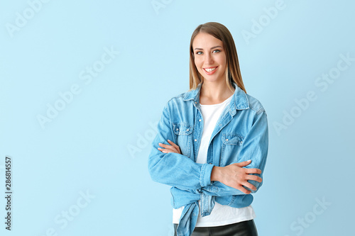 Happy young woman on color ...