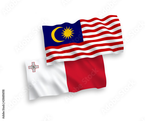 National vector fabric wave flags of Malta and Malaysia isolated on white background. 1 to 2 proportion.