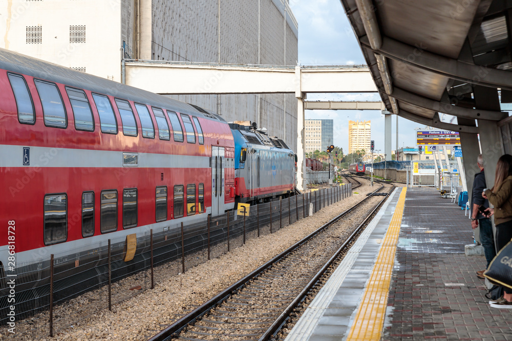 Intercity passenger train stands near the platform of the Mirkaz Shmona railway station in Haifa, Israel