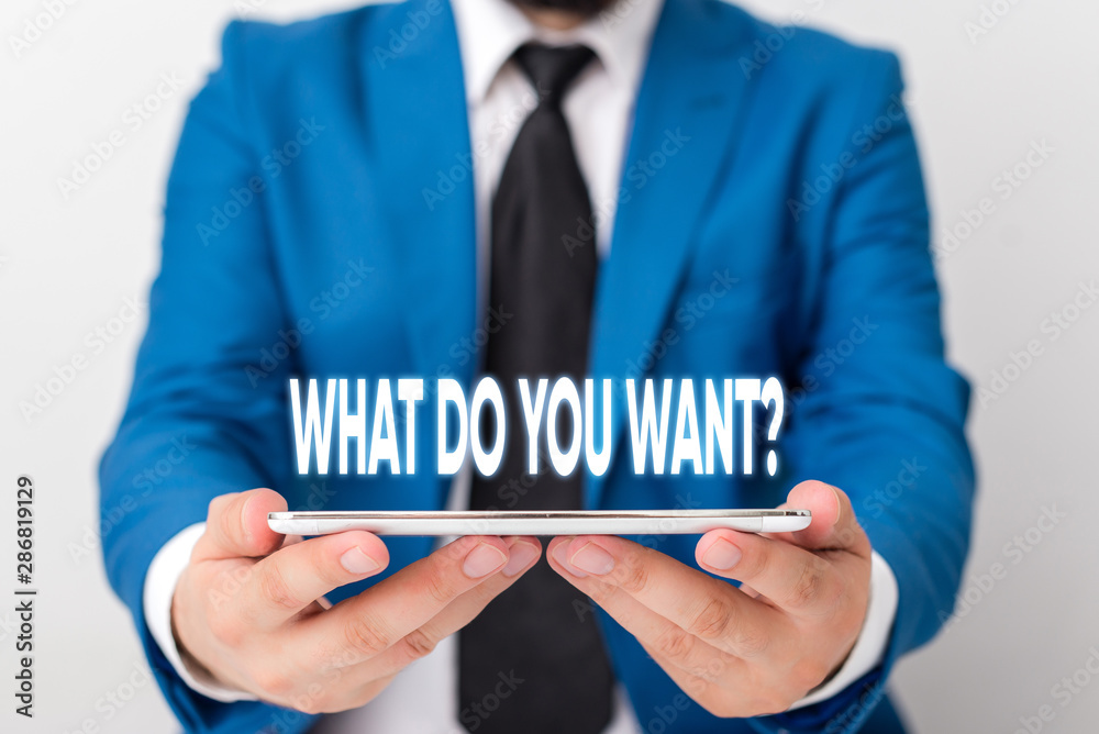 Handwriting text writing What Do You Want Question. Conceptual photo say or write in order to ask demonstrating about something Businessman in blue suite with a tie holds lap top in hands Handwriting text writing What Do You Want Question. Conceptual photo say or write in order to ask demonstrating about something Businessman in blue suite with a tie holds lap top in hands