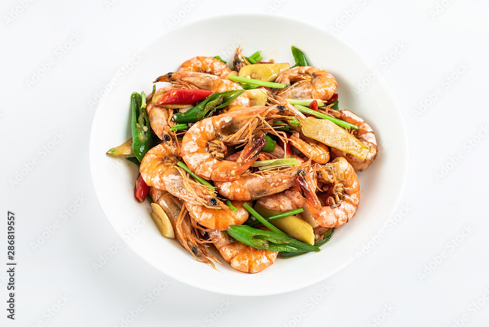 Chinese dish of spicy spicy black shrimp on white background Chinese dish of spicy spicy black shrimp on white background