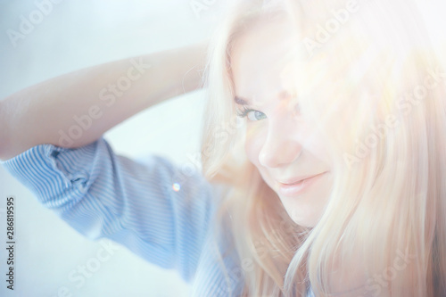 cute blond young adult   portrait of an adult beautiful girl model with blond hair in a happy image