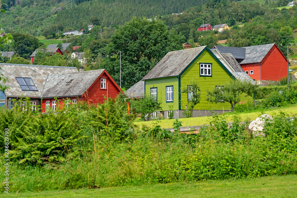 Rural houses in Rosendal village in summer, Norway