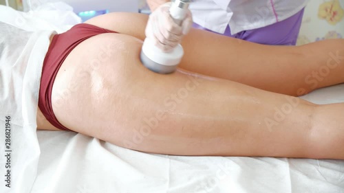Body treatment: woman getting rf lifting procedure to her buttocks. Perfect shape buttocks on anti-cellulite treatment. vacuum massage the buttocks