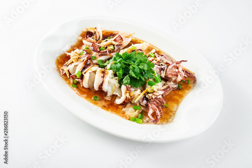 Chinese Cantonese cuisine home cooking, a dish of garlic steamed tubule squid on a white background