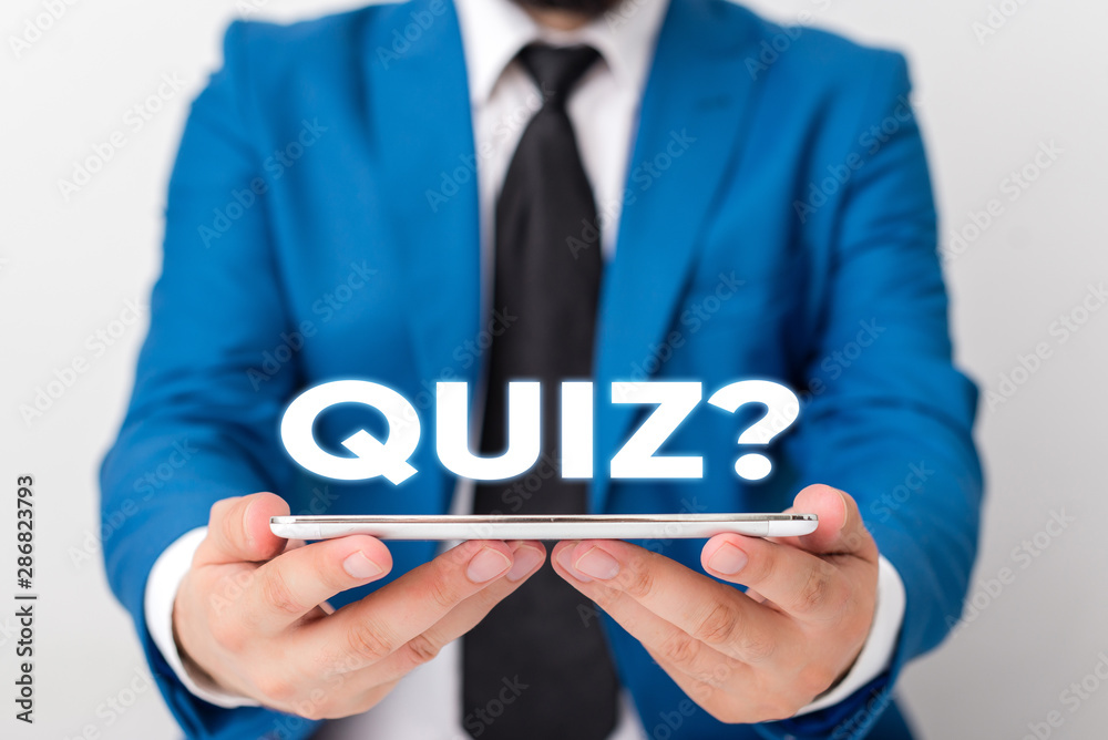 Handwriting text writing Quiz Question. Conceptual photo test of knowledge as competition between individuals or teams Businessman in blue suite with a tie holds lap top in hands Handwriting text writing Quiz Question. Conceptual photo test of knowledge as competition between individuals or teams Businessman in blue suite with a tie holds lap top in hands