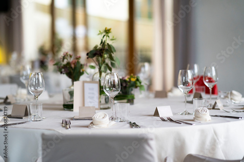 decorated wedding tables with flowers and Menu card