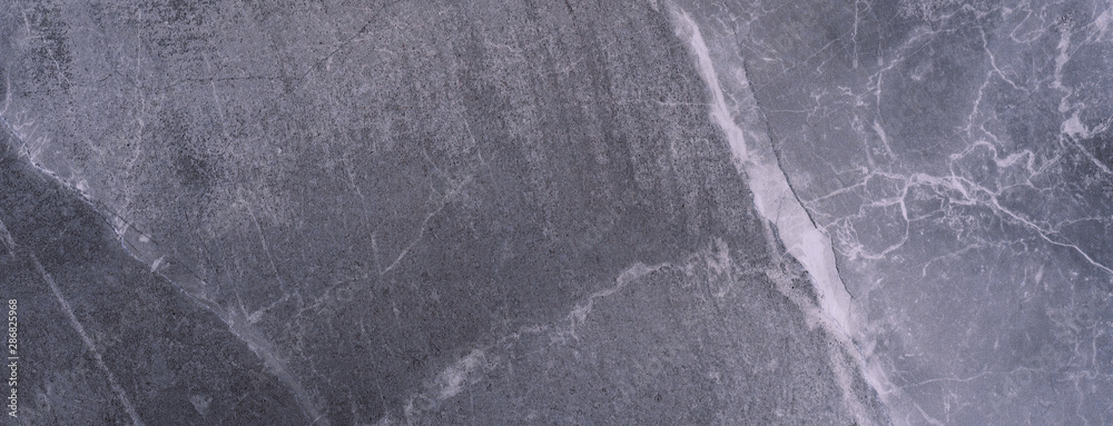 Naklejka premium Gray marble texture. Natural patterned stone for background, copy space and design. Abstract marble stone surface.